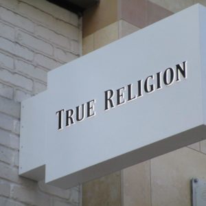 Example of specialty sign installation by NGS Films and Graphics at True Religion.