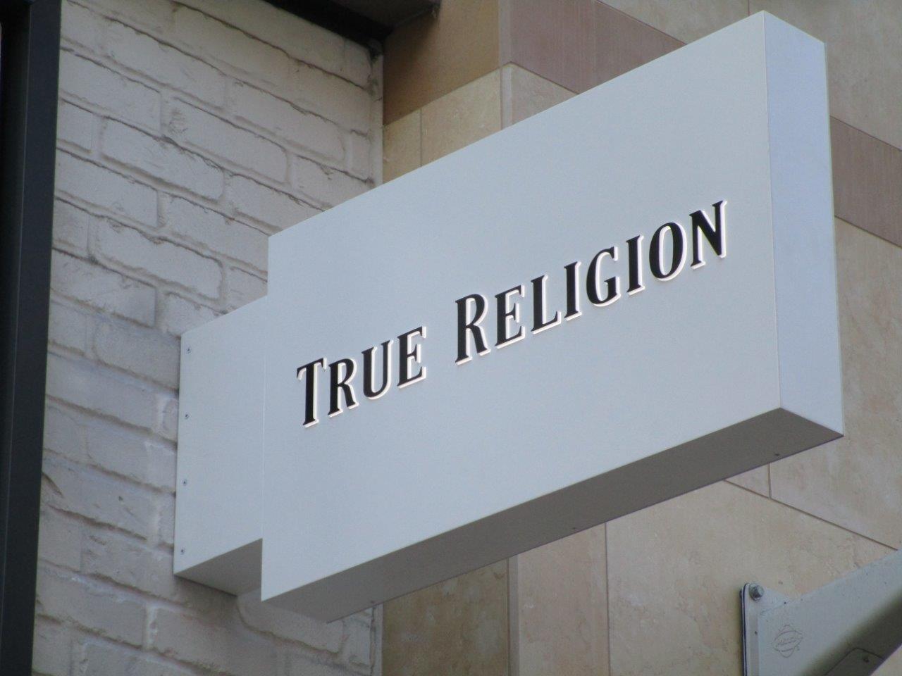 Example of specialty sign installation by NGS Films and Graphics at True Religion.