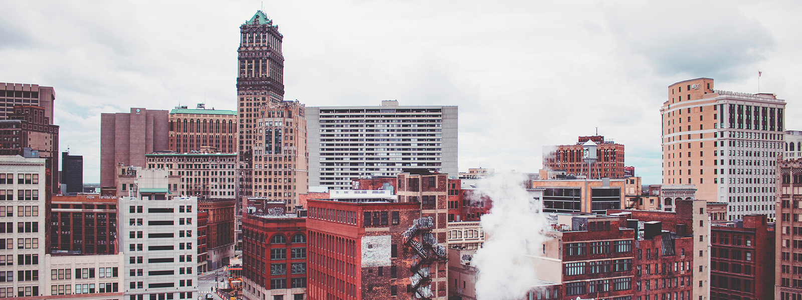 Michigan skyline of buildings with window film, graphics, and signage