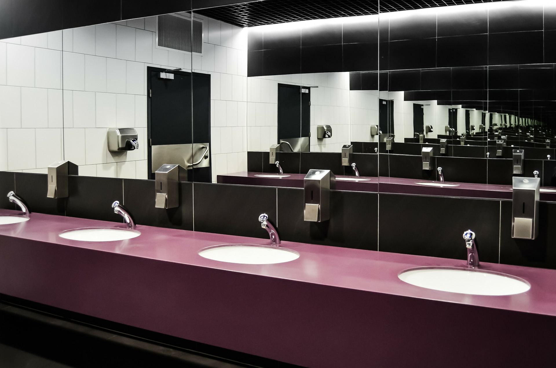 Bathroom featuring traditional standard glass mirrors with mirror protection film