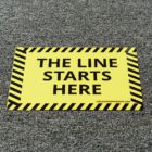 A sign stating where the line starts. This is a add on to a floor package you can purchase from NGS.