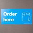 Order Here graphic on wall