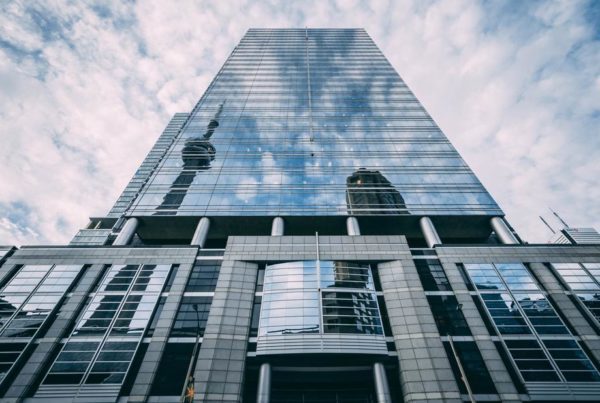 Tower with reflective, mirrored window film