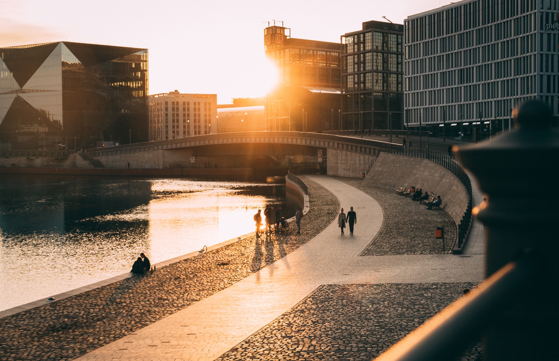 Image of people enjoying a walk alongside a riverway