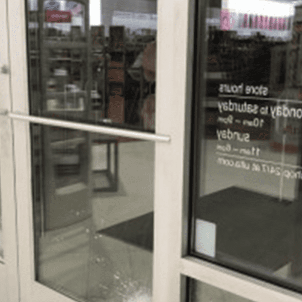 A close up picture of a store front, showing the riot glass installed.