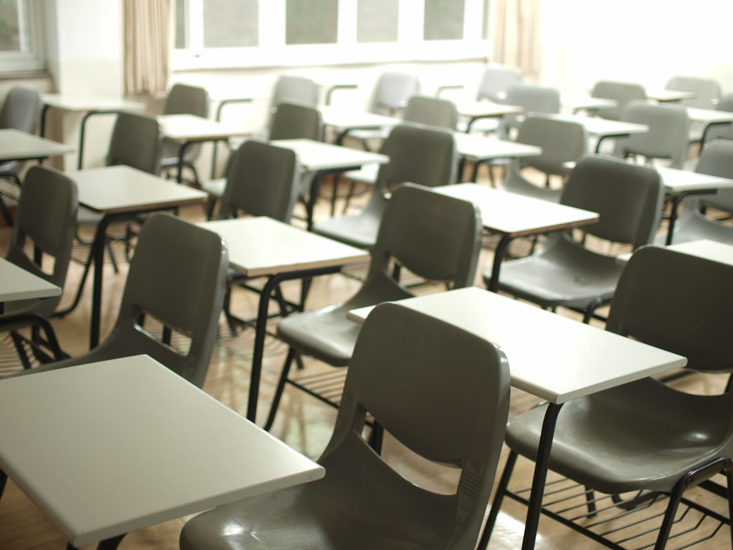 A classroom with chairs in a school with security window film installed with state funding