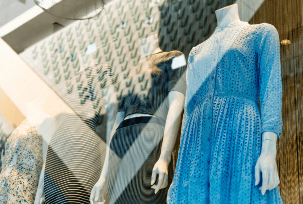 Retail display with four mannequins in a storefront window