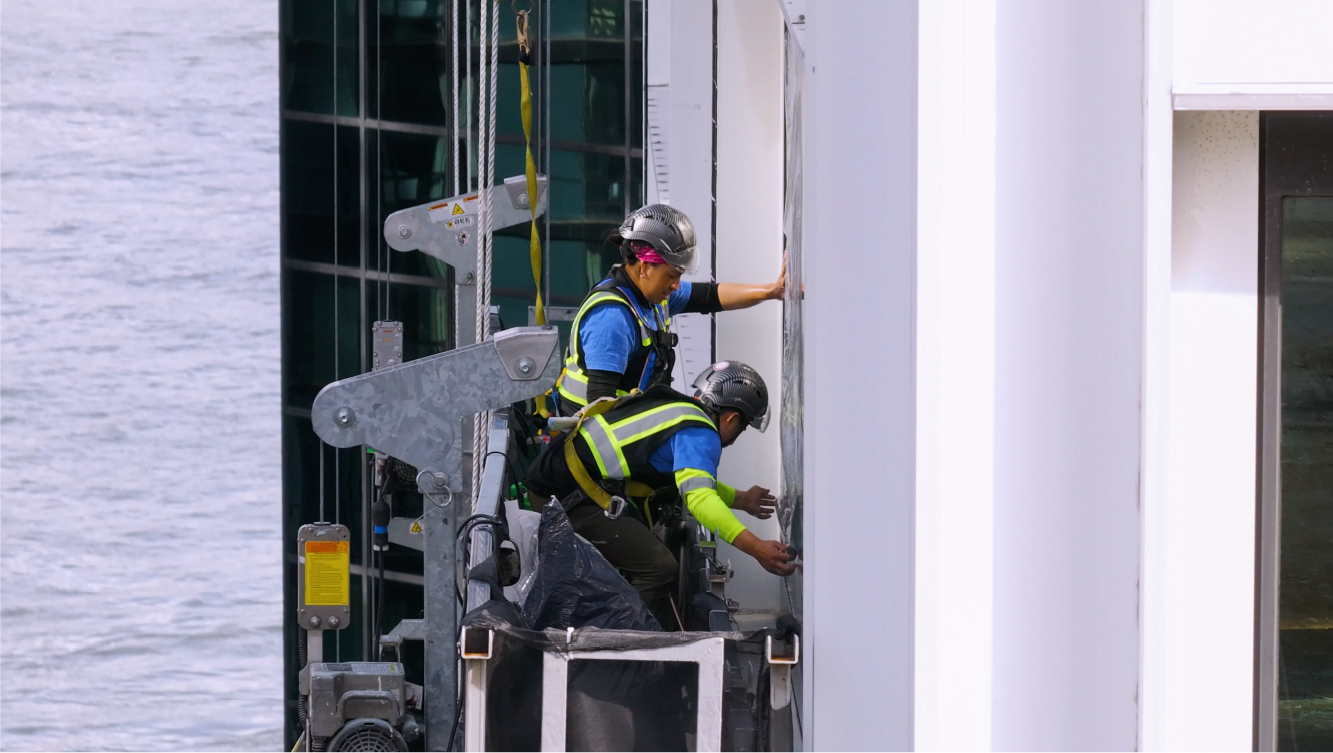 NGS window film installers installing Solar Window Film on a 34 story building in New York (Wall Street Plaza)